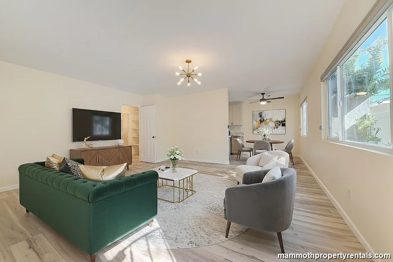 Living and dining area - generous open space perfect for midterm renters needing room to work and unwind.