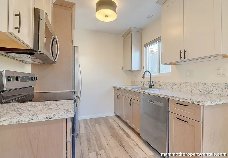 Kitchen with tile backsplash and modern cabinetry.