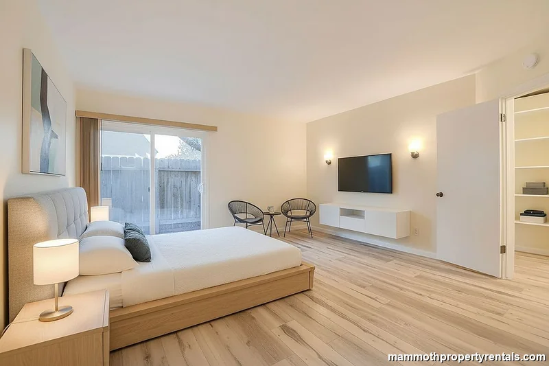 Master bedroom from a second angle - showing the full size and bright, open feel of this primary suite.