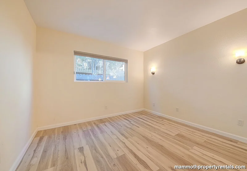 Second bedroom with closet - bright and comfortably sized, perfect as a guest room or home office.