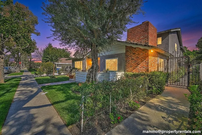 Evening view of the property - warm curb appeal in one of Long Beach's most sought-after historic neighborhoods.