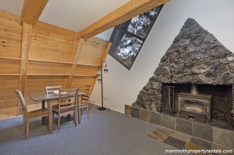 Fireplace and windows create warm ambiance
