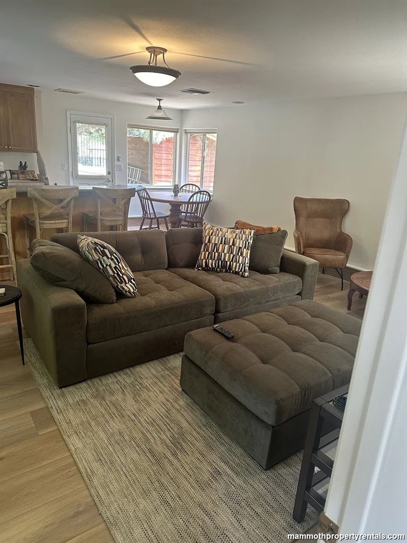 Living room flows to kitchen and dining